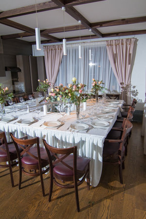Decorative elements for festive events, home decorations. Festive table decorations, flowers and tablewareの写真素材
