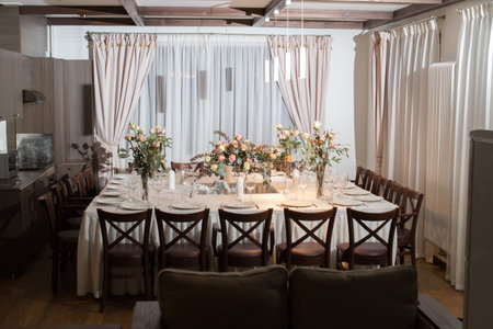 Decorative elements for festive events, home decorations. Festive table decorations, flowers and tablewareの写真素材