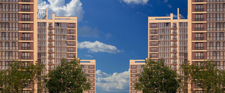 Modern buildings, walls and windows, reflections and sun rays. City view on a sunny day.