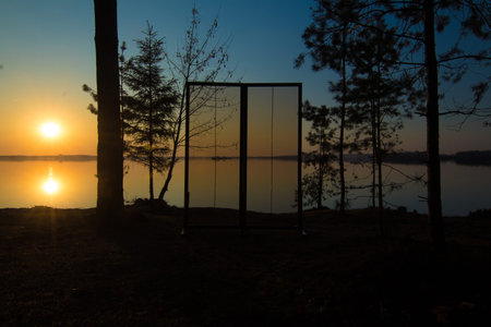 Glass window or doors. Orange and blue sky at sunset in the evening and night.の写真素材