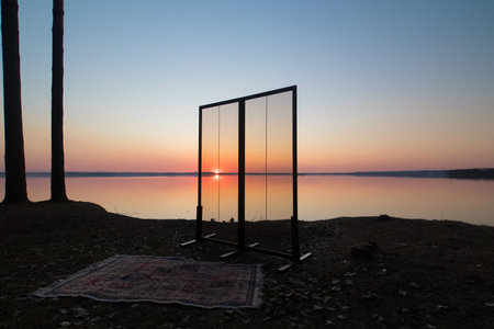 Glass window or doors. Orange and blue sky at sunset in the evening and night.の写真素材