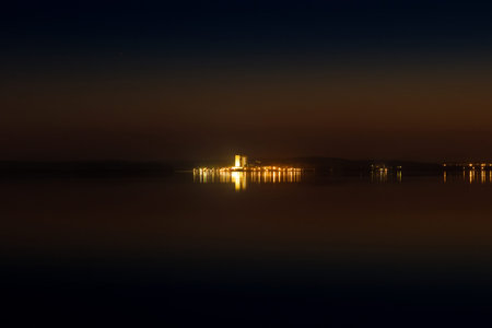 Orange and blue sky at sunset in the evening. Night view of the lake or seaの写真素材