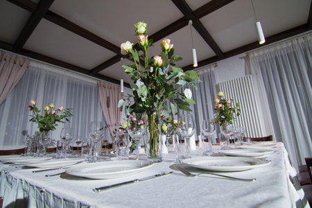 Decorative elements for festive events, home decorations. Festive table decorations, flowers and tablewareの写真素材