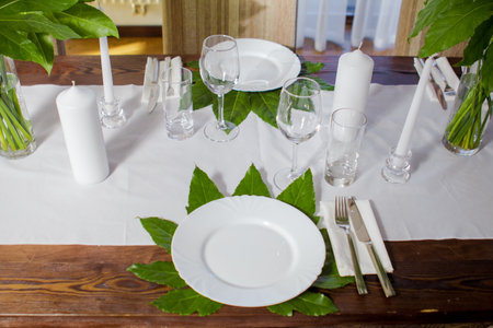 Decorative elements for festive events, home decorations. Festive table decorations, flowers and tablewareの写真素材