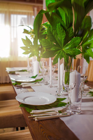 Decorative elements for festive events, home decorations. Festive table decorations, flowers and tablewareの写真素材