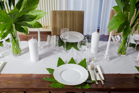 Decorative elements for festive events, home decorations. Festive table decorations, flowers and tablewareの写真素材