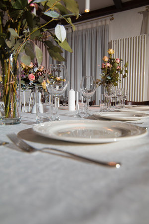 Decorative elements for festive events, home decorations. Festive table decorations, flowers and tablewareの写真素材