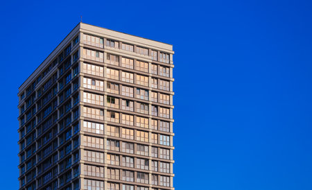 Modern buildings, walls and windows, reflections and sun rays. City view on a sunny day.の写真素材