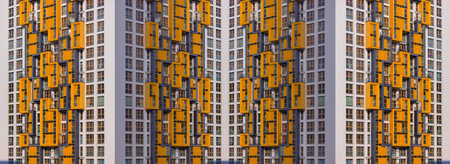 City view on a sunny day. Modern buildings, walls and windows.