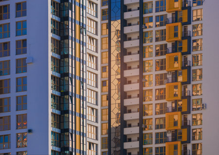City view on a sunny day. Modern buildings, walls and windows.の写真素材