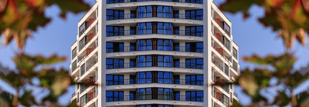 City view on a sunny day. Modern buildings, walls and windows.の写真素材