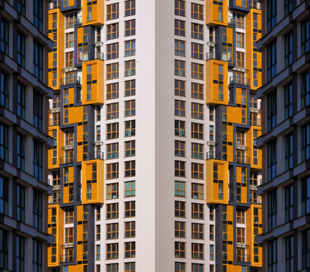 City view on a sunny day. Modern buildings, walls and windows.の写真素材