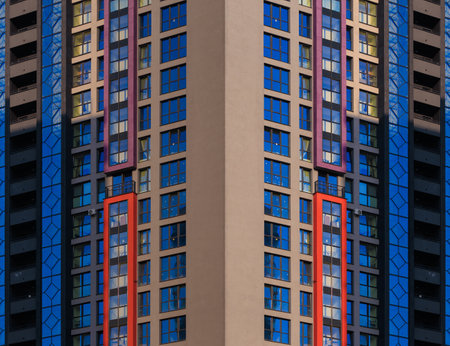 City view on a sunny day. Modern buildings, walls and windows.の写真素材