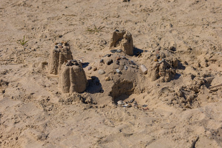 Texture of sand and earth, traces of human feet and shoes