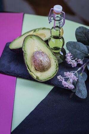Avocado oil in decorative glass jar with stars backgroundの写真素材