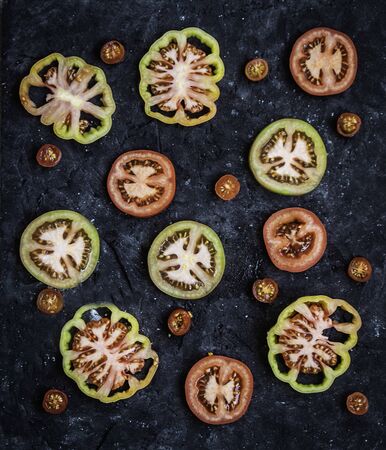 Aerial frame of tomato slices of different kindsの写真素材