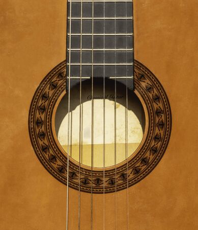 Spanish classical guitar, close-up Neck, mouth and strings of Spanish guitarの写真素材