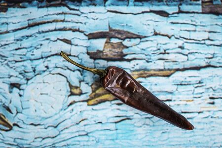 Red chilli pepper on vintage blue background Spicy chilli, food, dressingの写真素材
