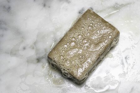 Bar of soap with bubbles Maintain hygiene and personal care with soap and waterの写真素材