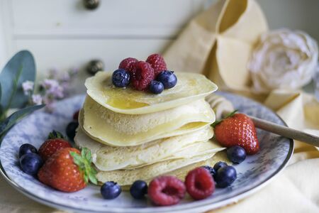 Sweet pancakes with strawberries and blueberriesの写真素材