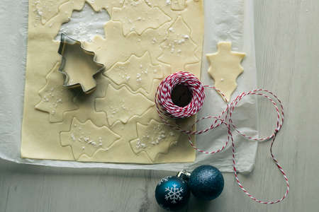 Christmas tree silhouettes in fresh cookie dough