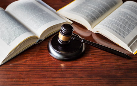 Judge's gavel and wooden block on booksの写真素材