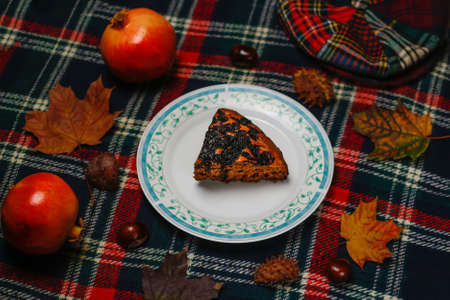 Defocus piece of chocolate cake on a white plate with blue ornate patterns Brownie Cake with...