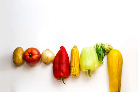 Fresh colorful organic vegetables on a white background, farming and healthy food concept. Copy space. Flat lay. a fresh group of vegetables on white background. Selective focus.の写真素材