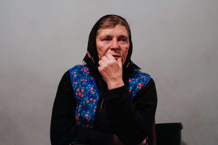 Defocus side view of two woman walking in pine forest and seating on log trunk. Leisure and people concept, mother and daughter walking in fall forest. People lost. Overall Vertical. Out of focus.の写真素材