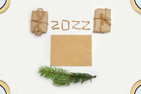 Blank eco card. Happy New year 2022. New Year Concept welcoming New Year 2022 written by craft rope...