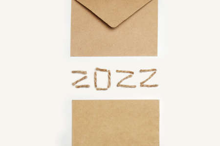 Blank eco card. Happy New year 2022. New Year Concept welcoming New Year 2022 written by craft rope...