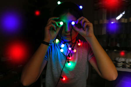 Christmas student. Funky young woman celebrating christmas. Young person having fun on winter...