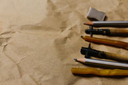 Tools for decorating Paschal eggs, Pysankas. rustic background. Collection pens and pencils. Homemade pen for drawing eggs. Holiday preparation. craft paper. Ukrainian tradition. copyspace.の写真素材
