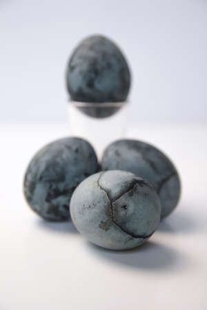 Defocus blue eggs. Close up Easter eggs pastel colored on white background. Minimal Easter celebration concept. Design, visual art, minimalism. Balance and harmony concept. Out of focus.の写真素材