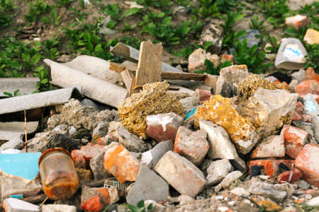 Defocus huge ruins, wreck in Ukraine, war. House after russian attack. Large garbage pile on nature...