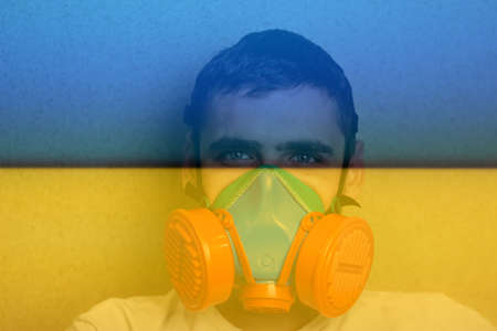 Defocus portrait of young man in dark kitchen. Millennial dark portrait. Mental health. Crisis, despair, pain. Out of focus.の写真素材