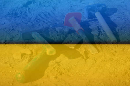 Defocus hammer, mallet, chisel and bayonet of the shovel lie on the ground. Set of tools for laying...