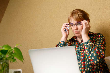 Defocus woman wear eyeglasses. working on laptop. Business smart people. Young lady seating and...