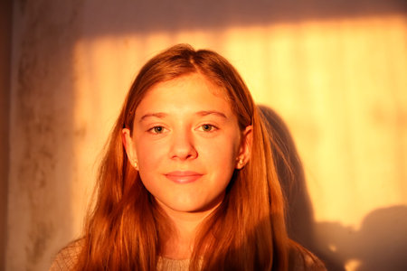 Defocus portrait beautiful young caucasian girl happy face smiling in sunny day. Portrait of young...