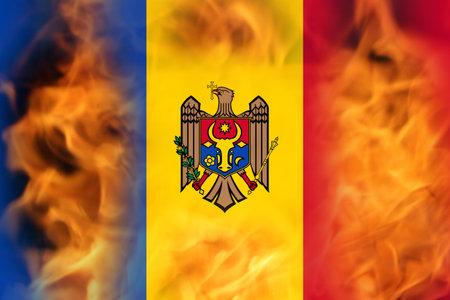 Defocus protest in Moldova. Moldova flag painted on fire flame background. Strength, Power, Protest concept. Russia war. World crisis. Out of focus.の写真素材