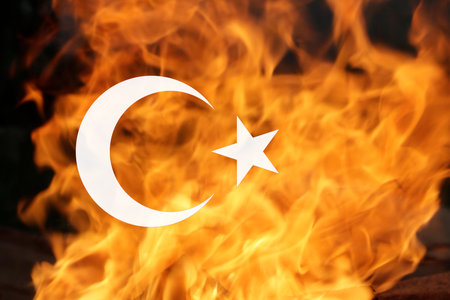 Turkey Earthquake, February 6, 2023. Mournful banner. The Epicenter of the earthquake in Turkey. Pray for Turkey. A bright fire flame background of the Turkish flag.の写真素材