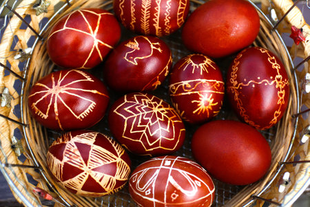 Easter eggs top view. Closeup of basket of colored red eggs, Easter holiday concept. Collection of pysanka or krashanka. Close up. Out of focus.の写真素材