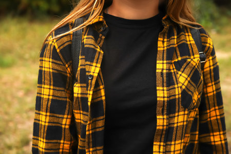 Hipster woman style. Millennial yellow and black checkered plaid shirt. Design. Fashion lifestyle. Casual clothesの写真素材