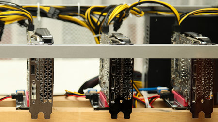 A detailed close-up of a high-performance video card, the heart of a Bitcoin mining rig. crypto...