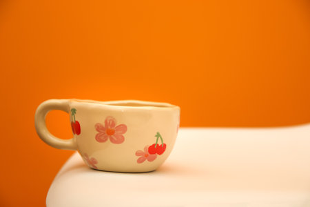 a cozy, relaxing moment in autumn fall, focusing on a cup of hot tea or drink set on a table.