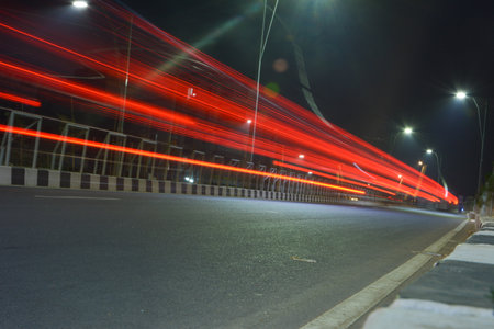 Motion light trails of vehicle in the road at nightの写真素材