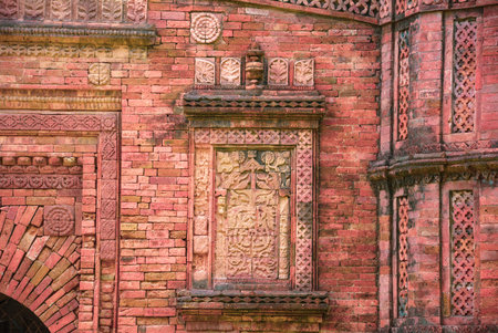 Terracotta of a  Khania Dighi mosque's wall.The mosque is surrounded by a mango garden along with a lake named âKhania Dighiâ or âKhanjan Dighiâの写真素材