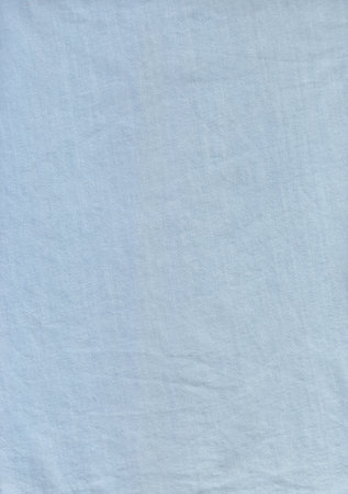 A sky blue color fabric Background. A jeans fabric use for making shirt.の写真素材