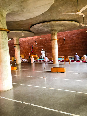 Dhaka, Bangladesh- 5th August 2019: Adhan calling for praying by a muezzin in Mayor Hanif Mosque. A contemporary mosque with mushroom column.のeditorial素材
