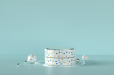 Metallic terrazzo podium surrounded by assorted balls and blueの写真素材